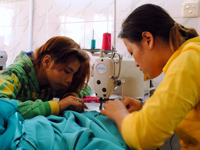 outreach_cgi_daughters_sewing